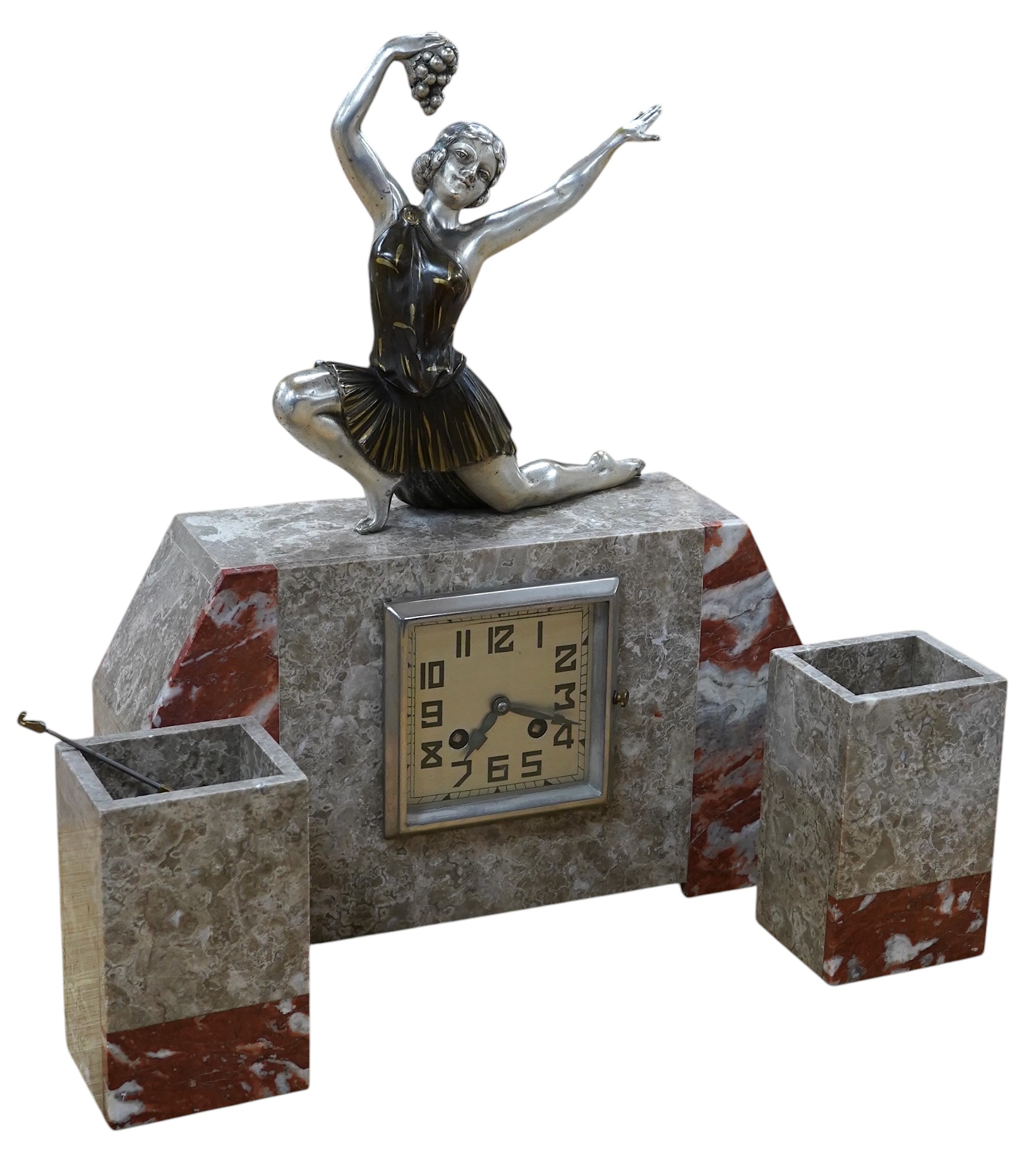 A French Art Deco clock garniture of mixed marble with chromed and painted spelter female dancer surmount. 40cm high. Condition - good